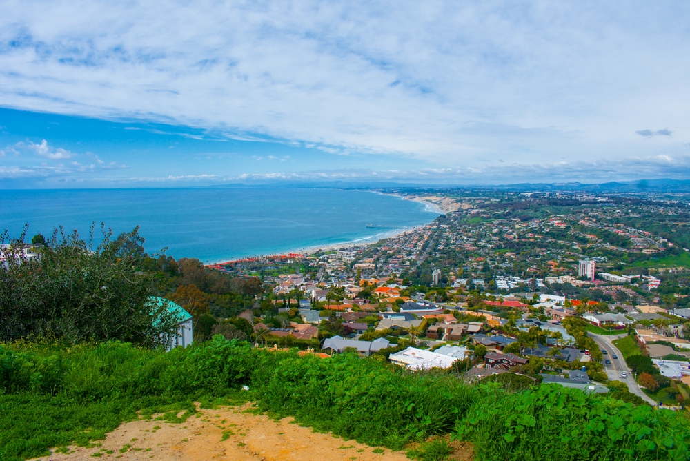 Panoramic view of San Diego’s coastline and residential neighborhoods, highlighting the desirable locations where JP Buys SD helps clients sell property efficiently - JP Buys SD